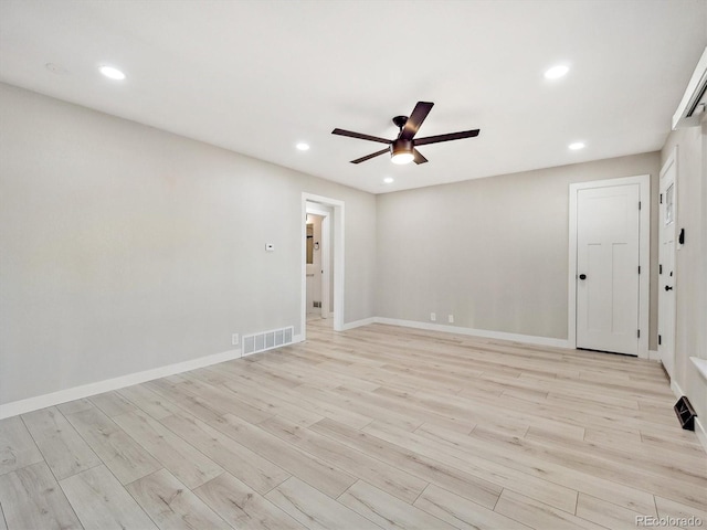 spare room featuring a ceiling fan, visible vents, recessed lighting, and light wood-type flooring