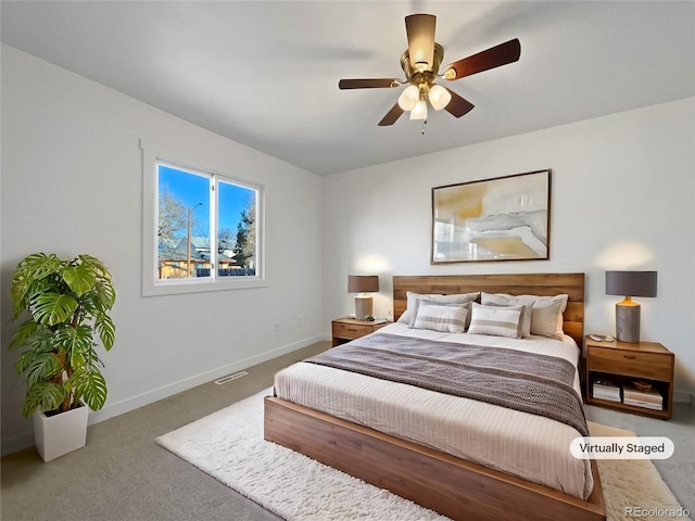 bedroom with ceiling fan and carpet