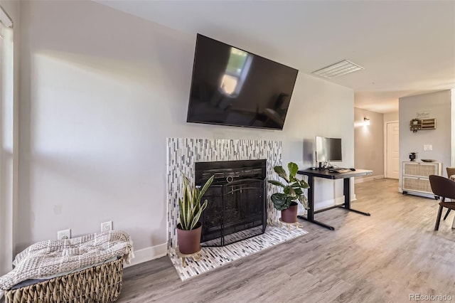 8450 Decatur St Unit 97, Westminster, CO 80031 - living room featuring wood finished floors and a brick fireplace