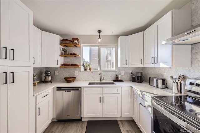 8450 Decatur St Unit 97, Westminster, CO 80031 - kitchen with appliances with stainless steel finishes, white cabinetry, and light countertops