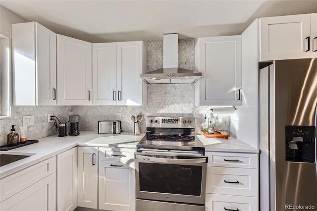 8450 Decatur St Unit 97, Westminster, CO 80031 - kitchen featuring wall chimney exhaust hood, appliances with stainless steel finishes, white cabinetry, light countertops, and tasteful backsplash