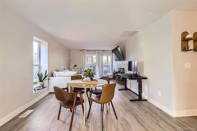 8450 Decatur St Unit 97, Westminster, CO 80031 - dining room featuring light wood finished floors and baseboards
