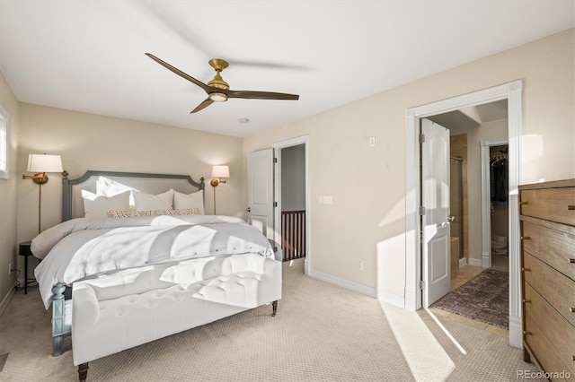 2801 W 23rd Ave, Denver, CO 80211 - bedroom featuring light colored carpet, a walk in closet, baseboards, and a ceiling fan