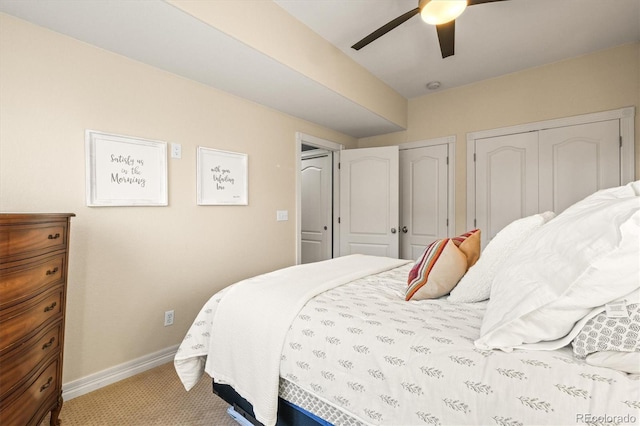 2801 W 23rd Ave, Denver, CO 80211 - bedroom with baseboards, ceiling fan, two closets, and light colored carpet