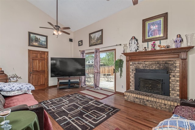 9400 W Burgundy Ave, Littleton, CO 80123 - living room with a ceiling fan, wood finished floors, a fireplace, and high vaulted ceiling