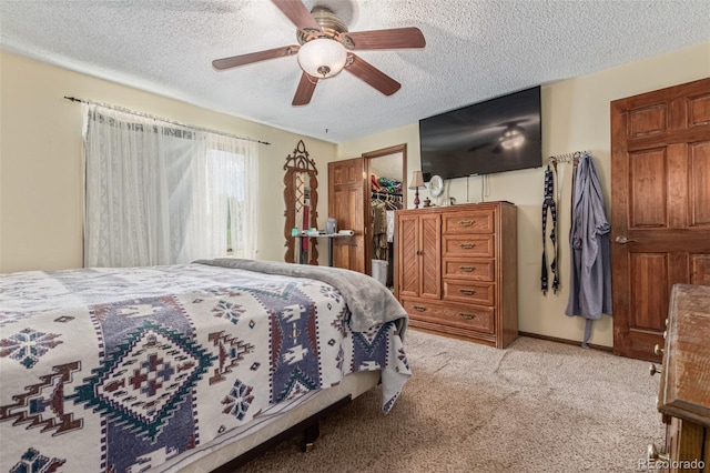 9400 W Burgundy Ave, Littleton, CO 80123 - bedroom featuring a textured ceiling, carpet, ceiling fan, and a spacious closet