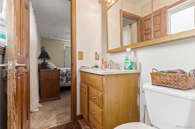 9400 W Burgundy Ave, Littleton, CO 80123 - full bathroom with ensuite bath, vanity, and wood finished floors