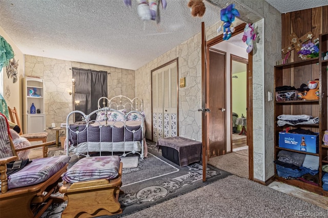 9400 W Burgundy Ave, Littleton, CO 80123 - bedroom featuring a textured ceiling, carpet floors, and a closet