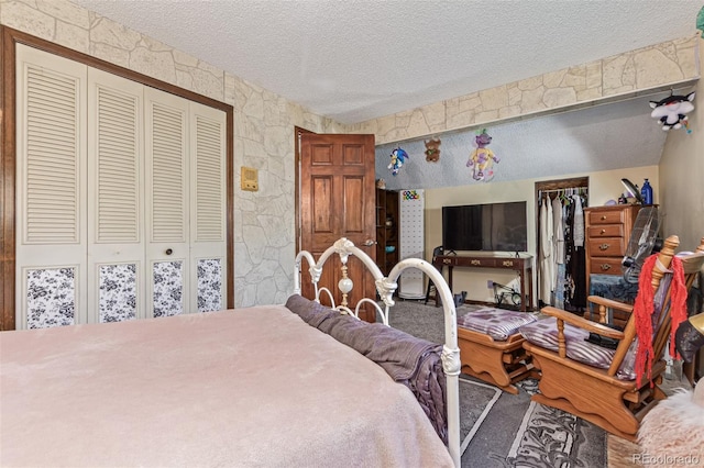9400 W Burgundy Ave, Littleton, CO 80123 - carpeted bedroom featuring a textured ceiling and a closet