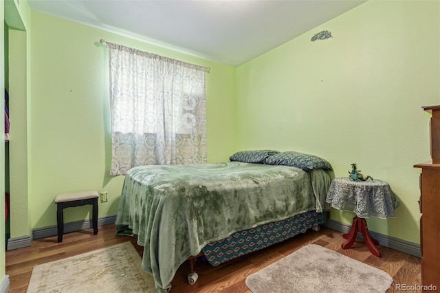9400 W Burgundy Ave, Littleton, CO 80123 - bedroom featuring baseboard heating and wood finished floors