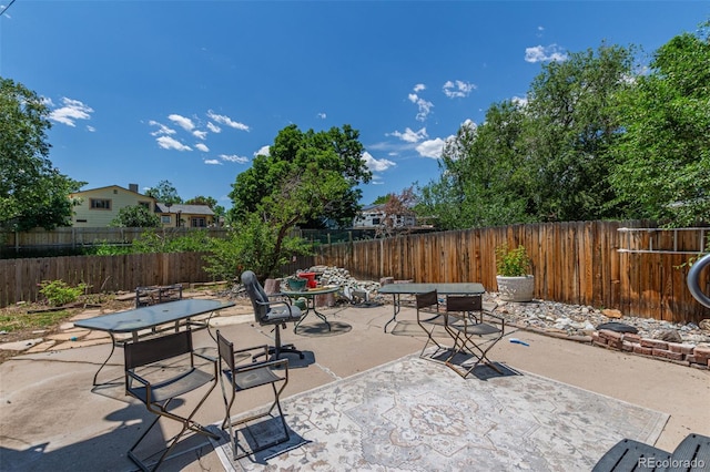 9400 W Burgundy Ave, Littleton, CO 80123 - fenced backyard with a patio and outdoor dining area