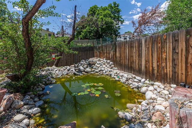 9400 W Burgundy Ave, Littleton, CO 80123 - view of yard with a small pond