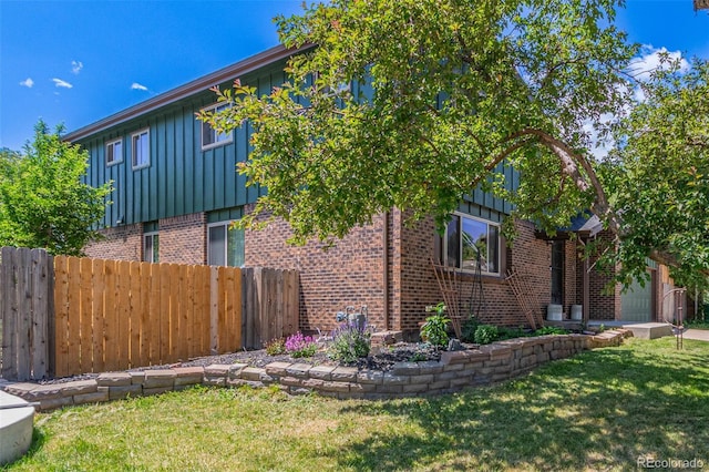 9400 W Burgundy Ave, Littleton, CO 80123 - view of side of home featuring brick siding and board and batten siding