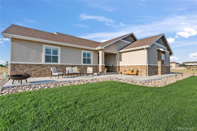 exterior space with a front yard, stone siding, a patio area, and stucco siding