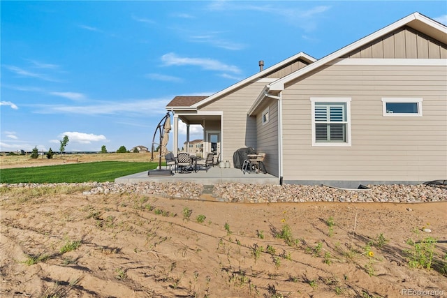 back of house featuring a patio