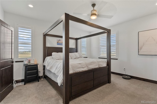 bedroom with light carpet, recessed lighting, a ceiling fan, and baseboards