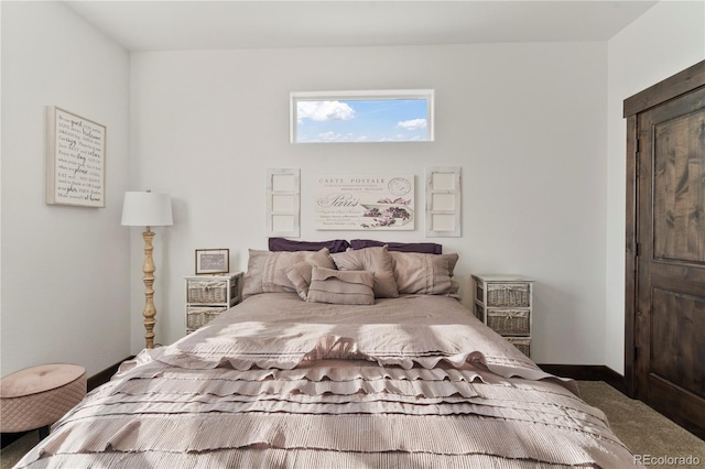 carpeted bedroom with baseboards