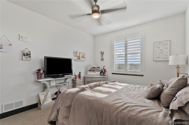 carpeted bedroom featuring baseboards, visible vents, and ceiling fan