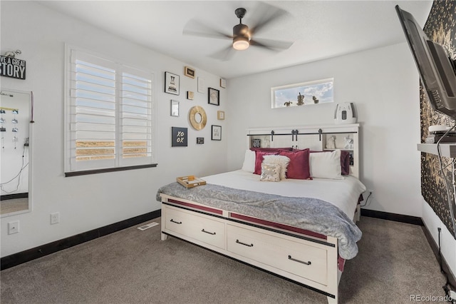 carpeted bedroom featuring a ceiling fan, visible vents, and baseboards