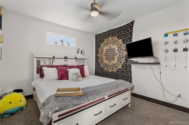 bedroom featuring a ceiling fan, dark carpet, and baseboards