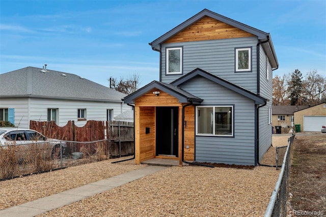 traditional home featuring fence