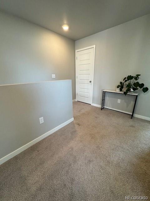 1353 Reynolds St Unit 5A, Fort Lupton, CO 80621 - carpeted spare room with baseboards