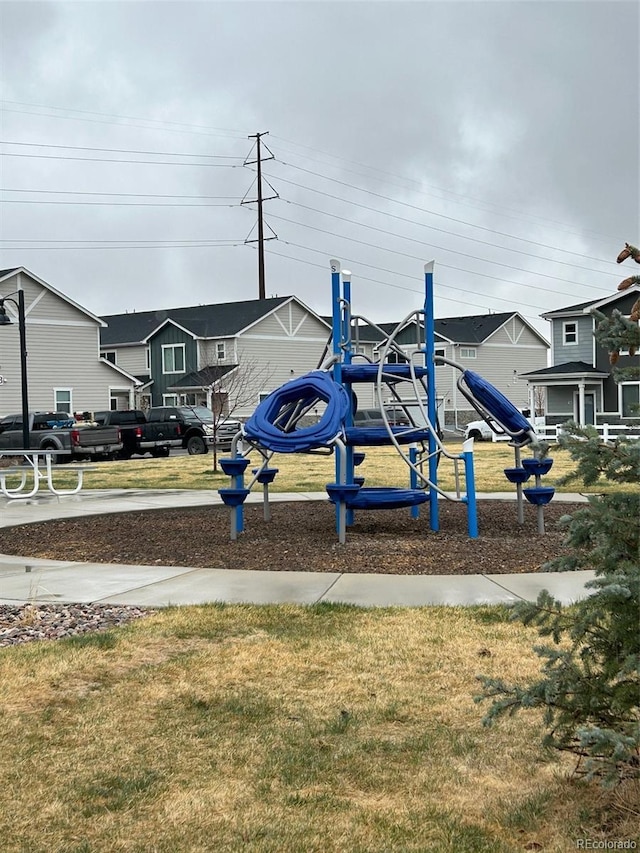 1353 Reynolds St Unit 5A, Fort Lupton, CO 80621 - communal playground with a lawn and a residential view