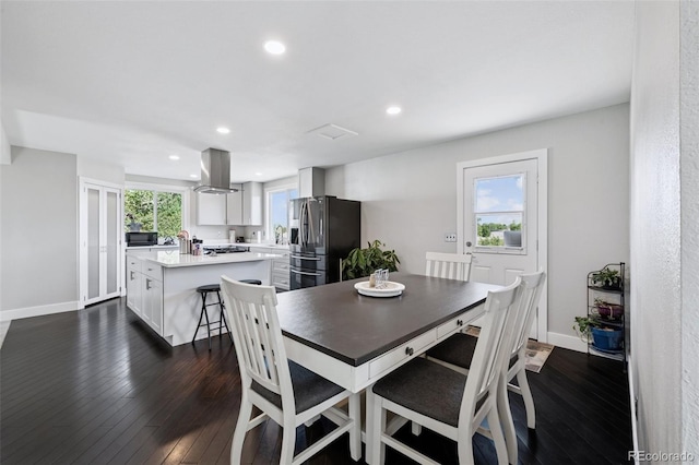 15528 Nancy Ave, Fort Lupton, CO 80621 - dining space featuring dark wood-style flooring and recessed lighting