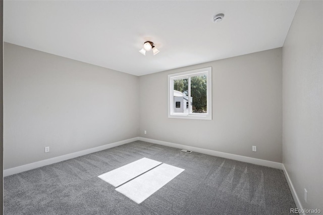 15528 Nancy Ave, Fort Lupton, CO 80621 - carpeted spare room with a smoke detector and baseboards