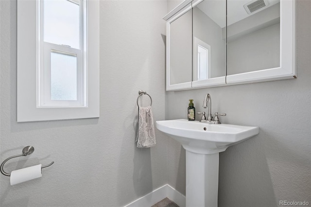 15528 Nancy Ave, Fort Lupton, CO 80621 - bathroom with a sink and baseboards