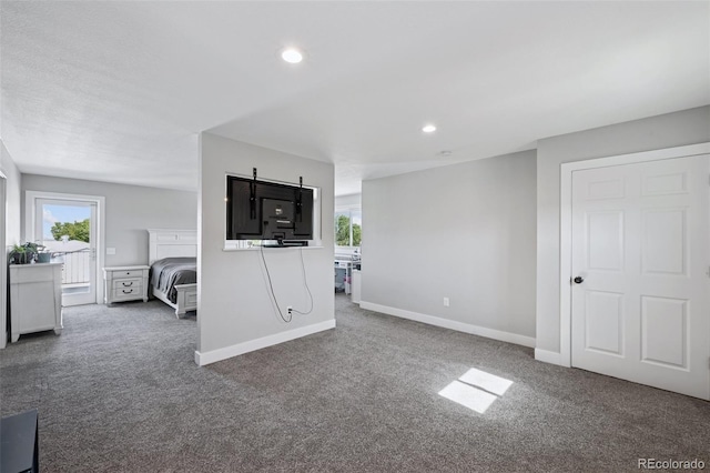 15528 Nancy Ave, Fort Lupton, CO 80621 - carpeted living area featuring plenty of natural light and recessed lighting