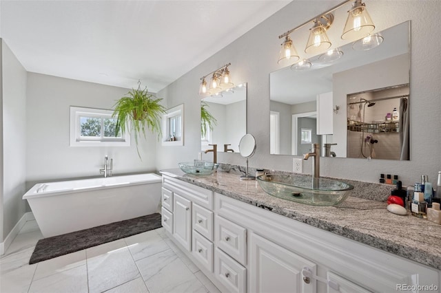 15528 Nancy Ave, Fort Lupton, CO 80621 - full bath with double vanity, a freestanding tub, marble finish floors, and tiled shower
