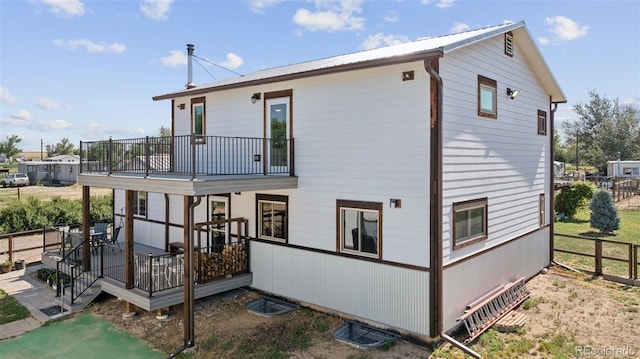 15528 Nancy Ave, Fort Lupton, CO 80621 - back of property with a balcony, a deck, and a metal roof