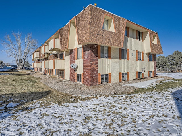 view of snow covered property