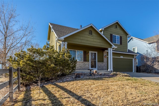 view of front of property with a garage, brick siding, fence, concrete driveway, and a front yard