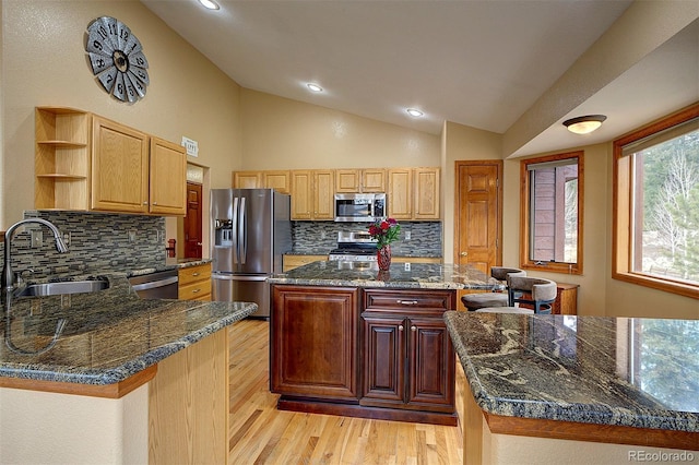 199 Elk Horn Ct, Bailey, CO 80421 - kitchen with appliances with stainless steel finishes, a sink, open shelves, light wood-style flooring, and lofted ceiling