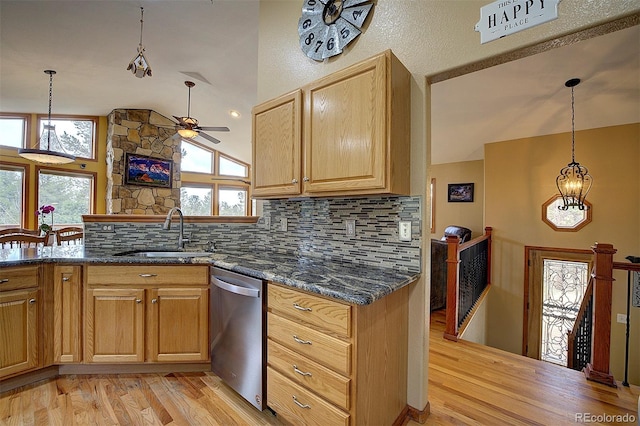 199 Elk Horn Ct, Bailey, CO 80421 - kitchen with a sink, dishwasher, light wood finished floors, decorative backsplash, and high vaulted ceiling