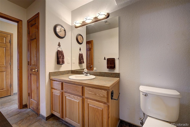 199 Elk Horn Ct, Bailey, CO 80421 - bathroom featuring vanity, toilet, and baseboards