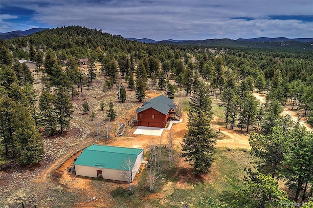 199 Elk Horn Ct, Bailey, CO 80421 - view from above of property with a forest and a mountain backdrop
