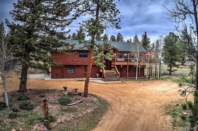 199 Elk Horn Ct, Bailey, CO 80421 - view of front of home with a wooden deck and stairway