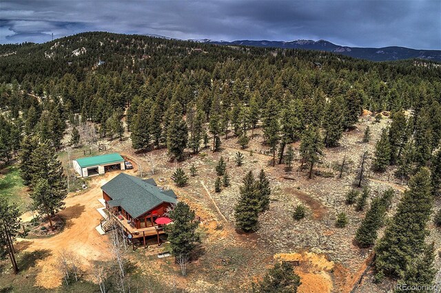 199 Elk Horn Ct, Bailey, CO 80421 - view from above of property featuring a heavily wooded area and a mountainous background