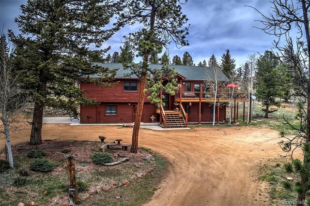 199 Elk Horn Ct, Bailey, CO 80421 - view of front of house with a wooden deck and stairs