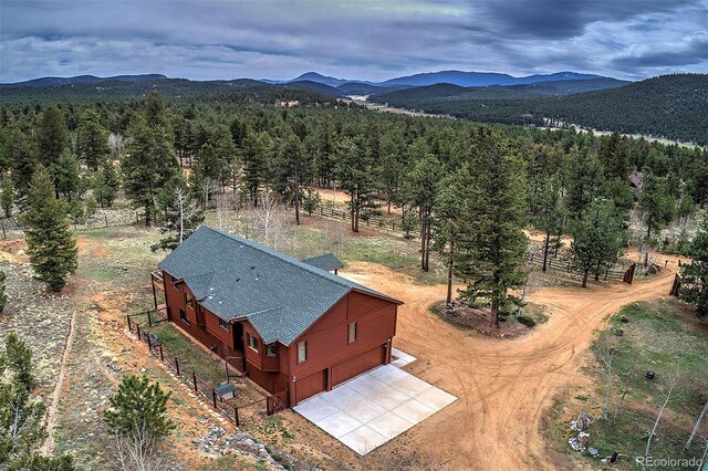 199 Elk Horn Ct, Bailey, CO 80421 - view of subject property featuring a mountainous background and a forest