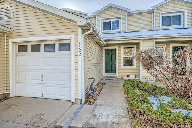 view of exterior entry featuring a garage