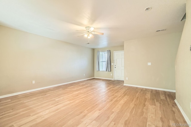 unfurnished room featuring ceiling fan and light hardwood / wood-style flooring