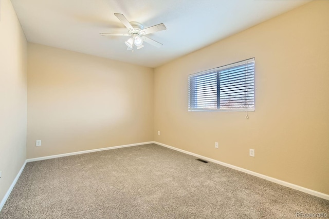 carpeted empty room with ceiling fan