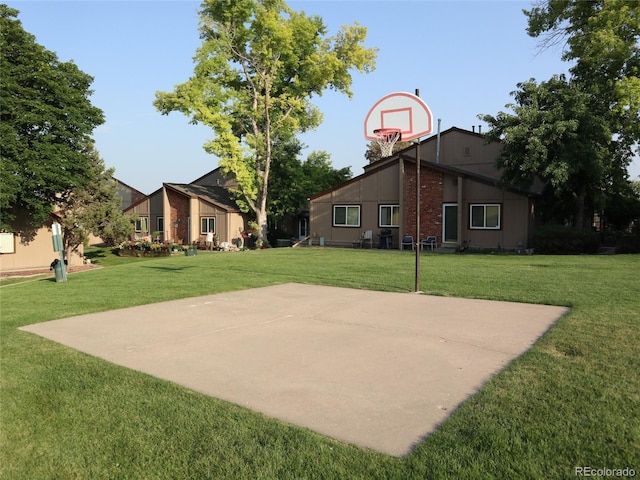 7700 W Glasgow Pl Unit 1A, Littleton, CO 80128 - view of sport court with basketball court and a lawn