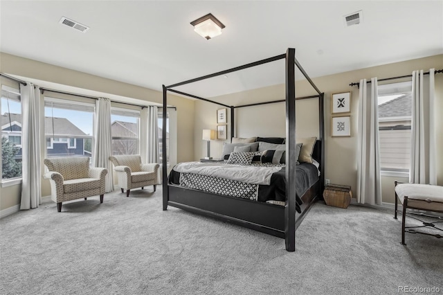 carpeted bedroom featuring baseboards