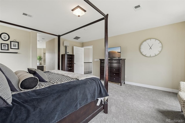 bedroom featuring light colored carpet and baseboards