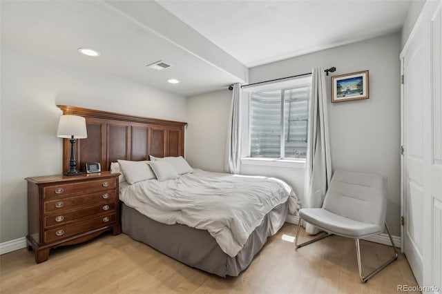 bedroom with light wood finished floors, baseboards, and recessed lighting